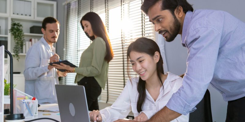 Group of multiethnic young business friends gathered in a modern office conference room and worked as a team.