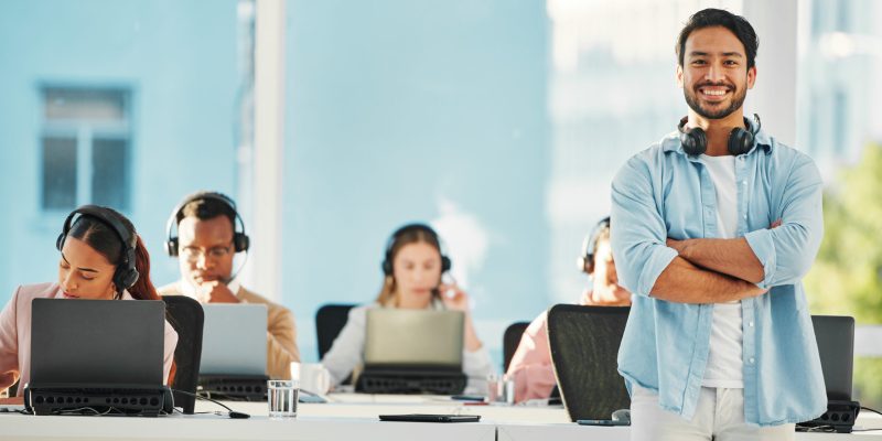 Happy asian man, portrait and call center professional in confidence, customer service or leadershi.